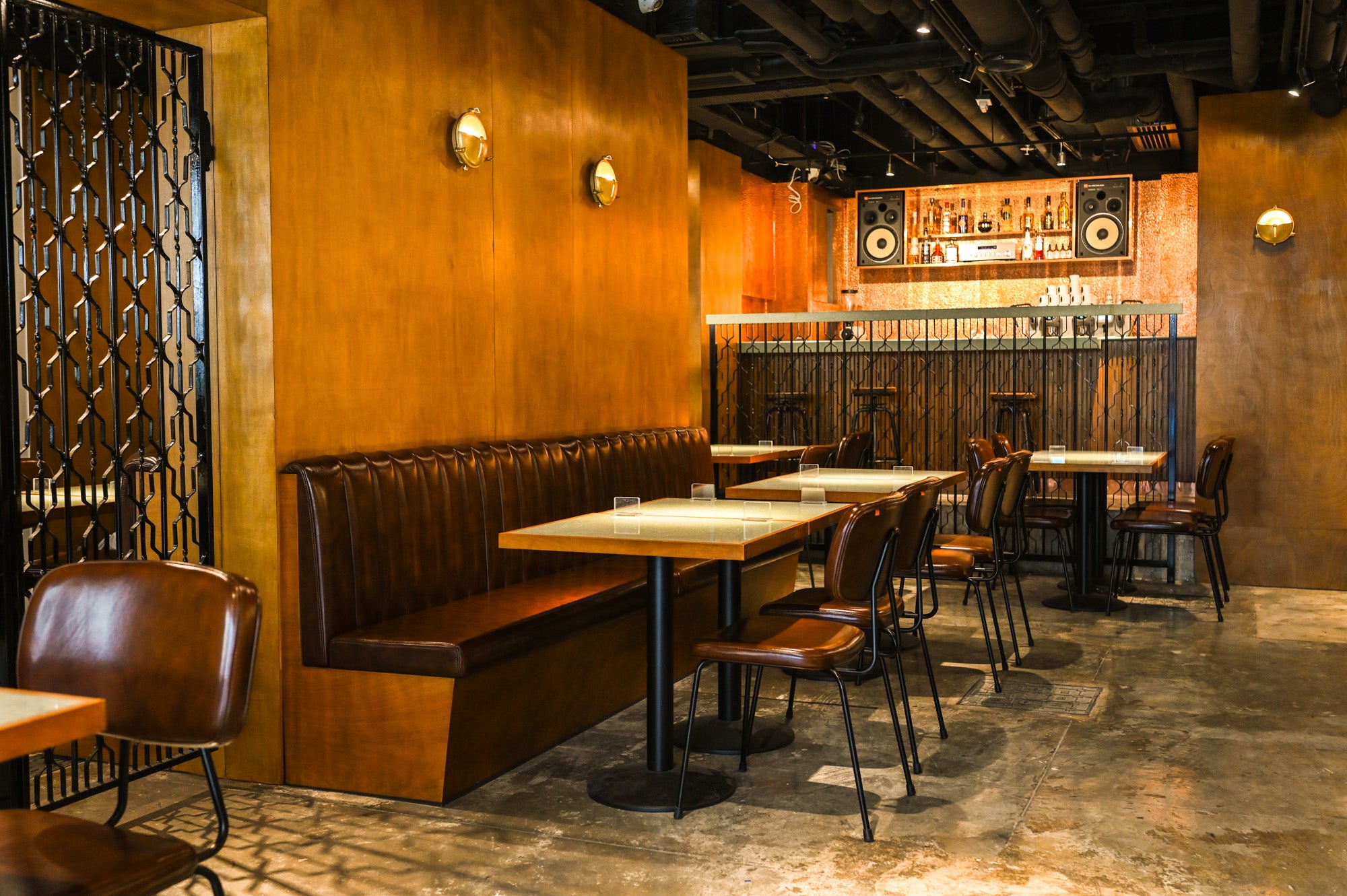 Copper walls, leather chairs and black metal dividers at Urban Coffee Roaster on Cleveland Street.