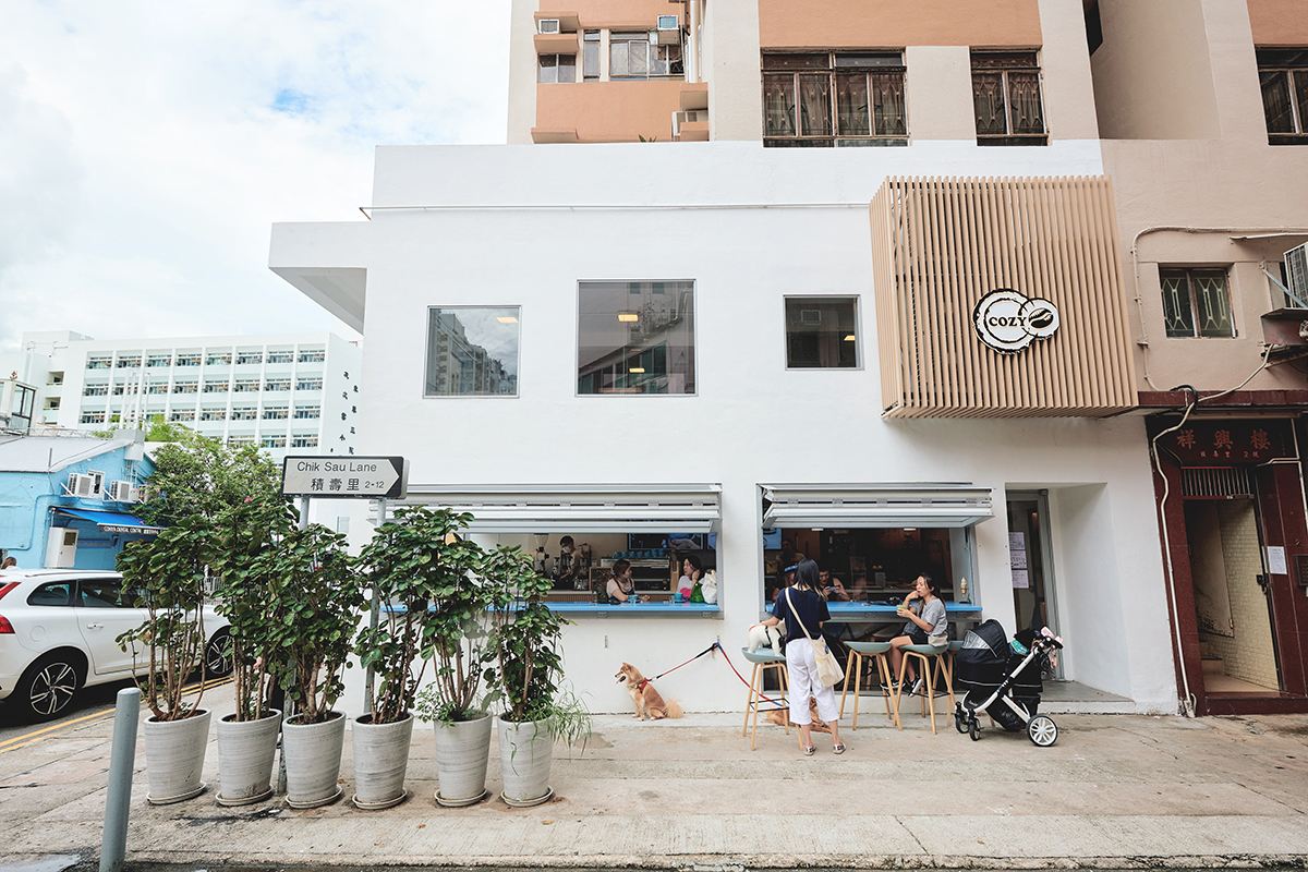 Cozy Coffee Club Tai Wai corner storefront beside the Chik Sau Lane street sign