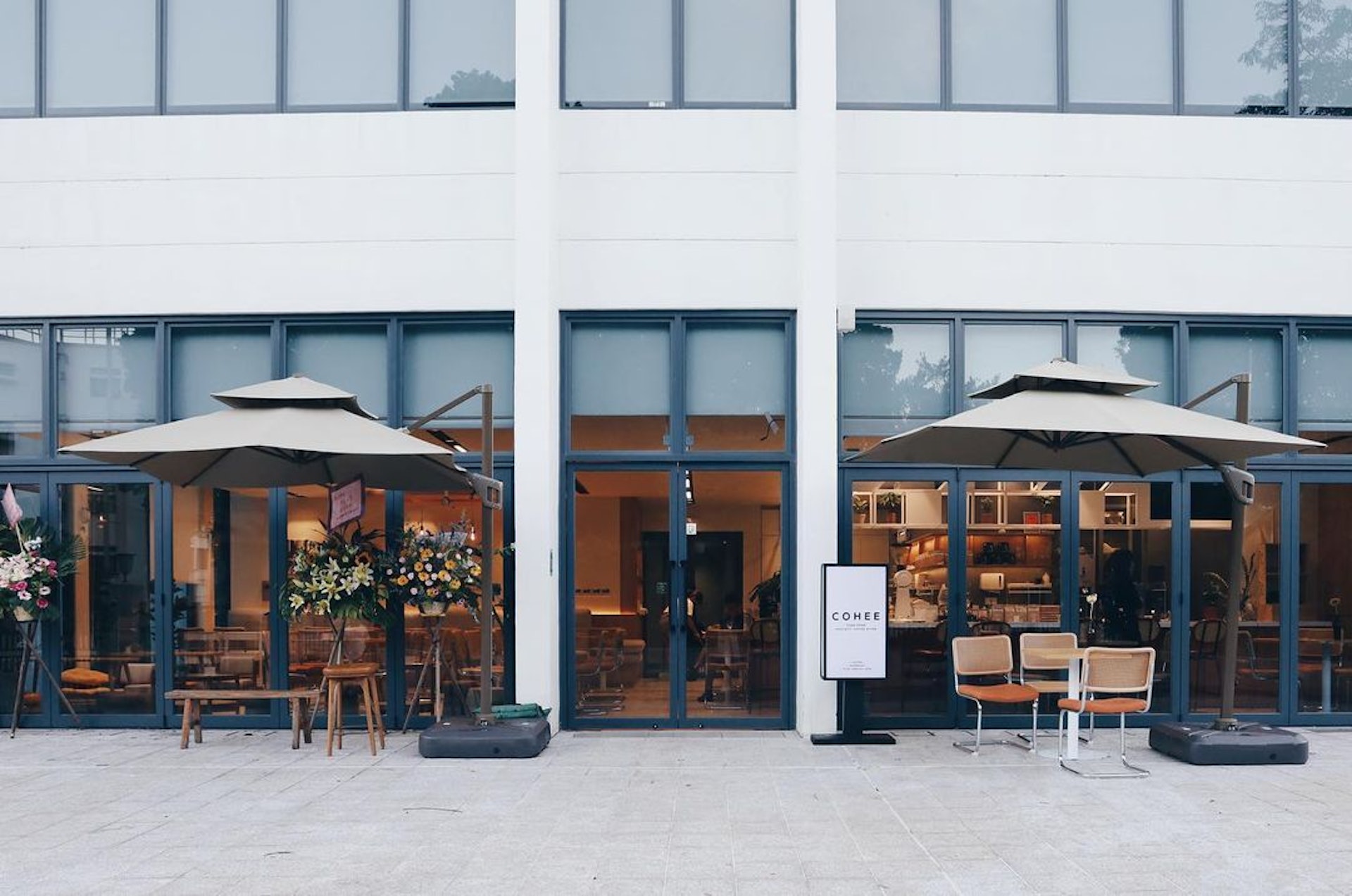 CoHee’s glass-fronted Fanling café and outdoor umbrella tables at the former magistracy.
