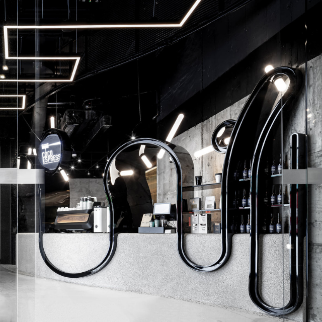 Sculptural black window frame and counter at Coco Espresso Kowloon Bay