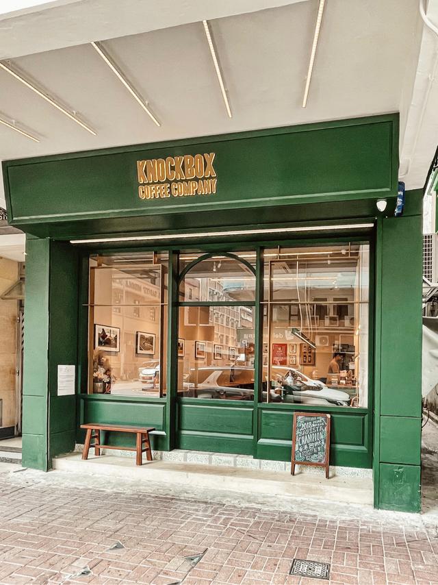 Green storefront of Knockbox Coffee Company on Hak Po Street