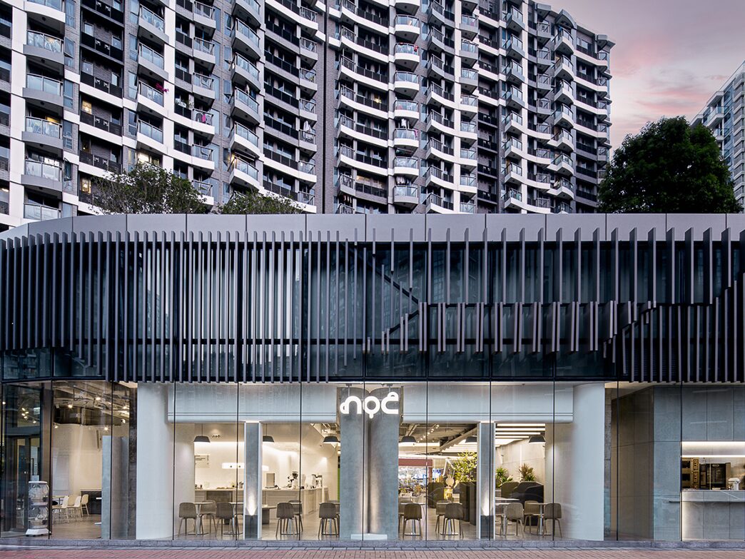 NOC Papillons Square glass-fronted cafe beneath Tseung Kwan O residential towers