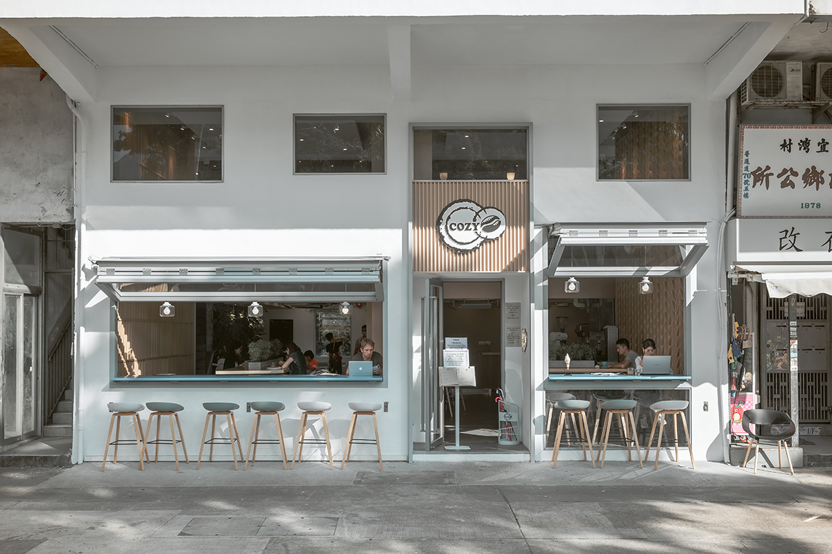 Cozy Coffee Club’s white two-level street façade in Sai Kung.