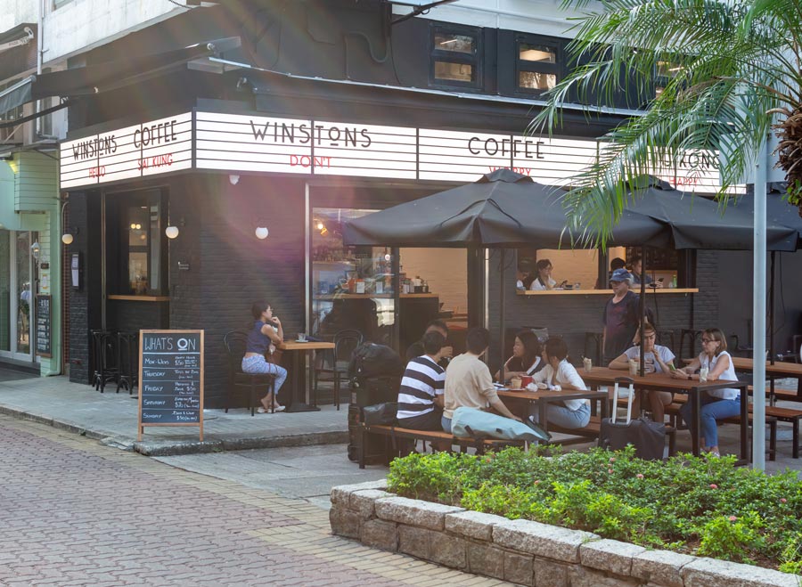 Outdoor tables beneath Winstons Coffee’s marquee at its Sai Kung branch.
