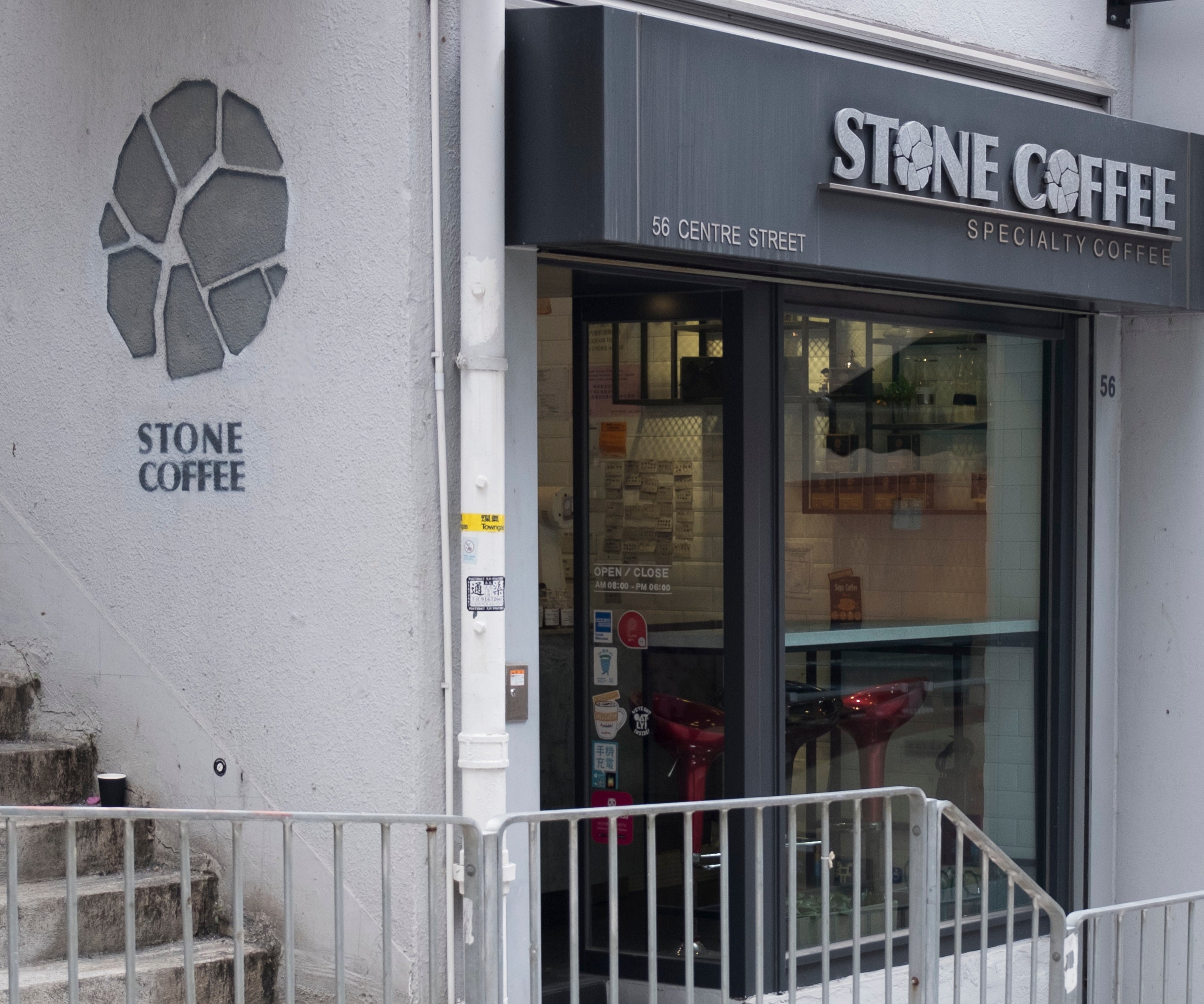 Stone Coffee’s glass storefront with the 56 Centre Street address above the entrance.