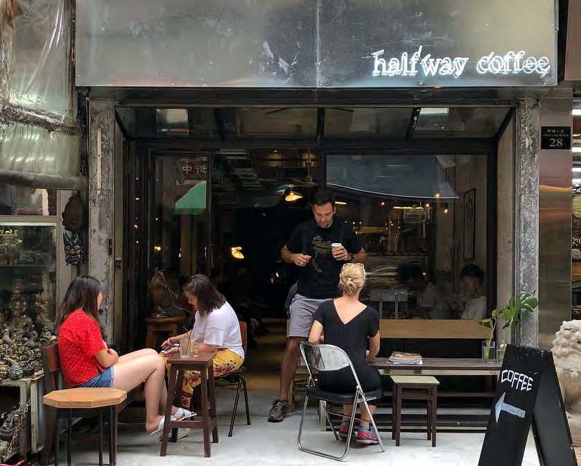 Halfway Coffee’s open storefront, vintage benches and customers on Upper Lascar Row.
