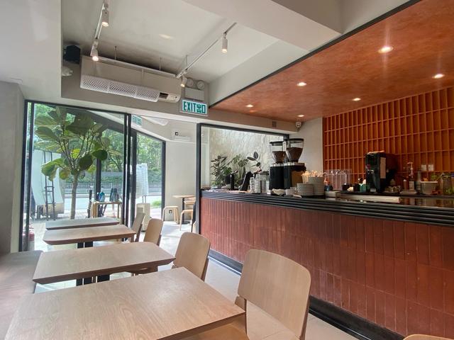 The timber coffee bar and seating at Boundless by REACTION in Tai Po.