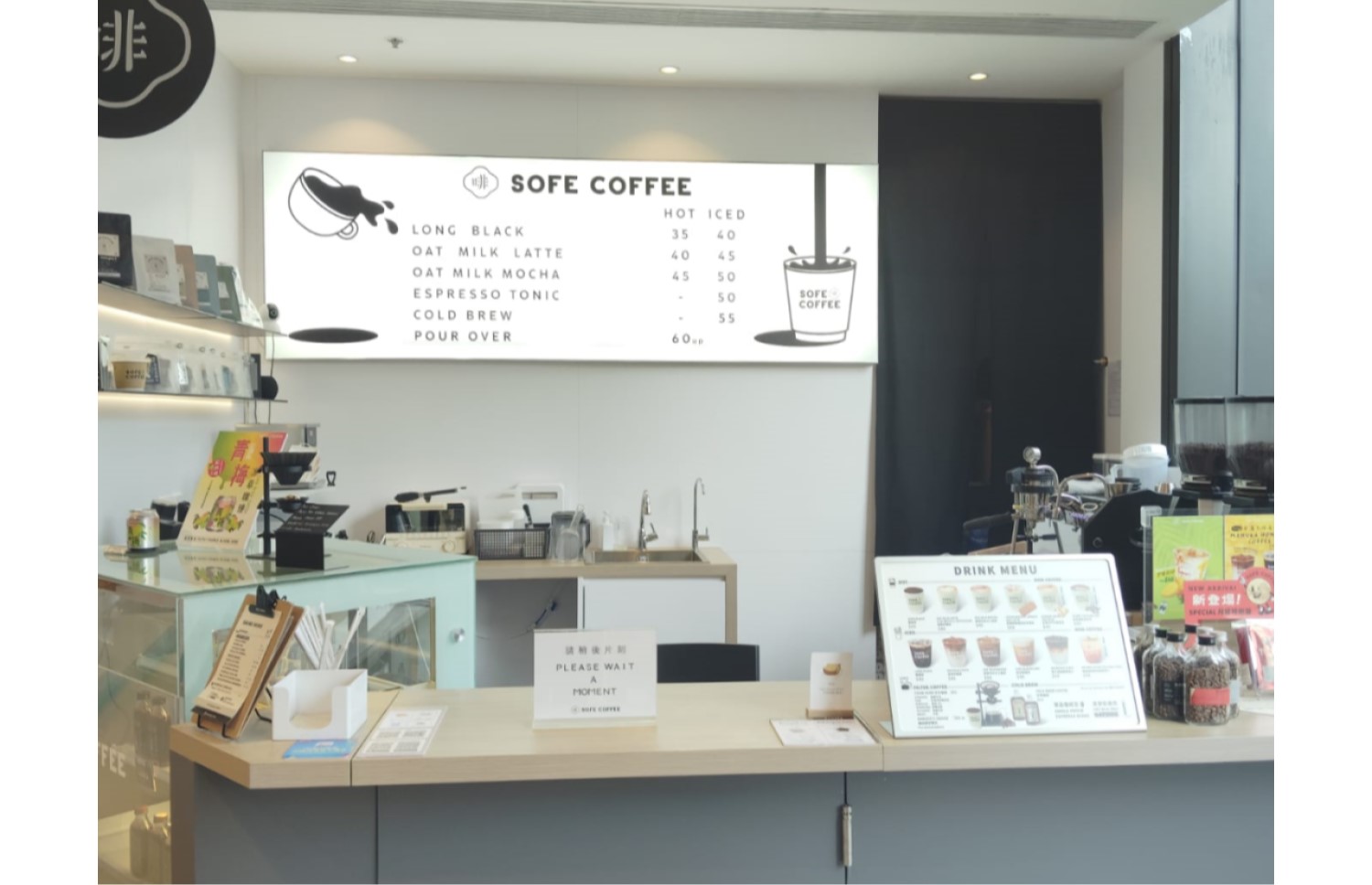 SOFE Coffee’s compact coffee counter and illuminated menu inside The Wai.