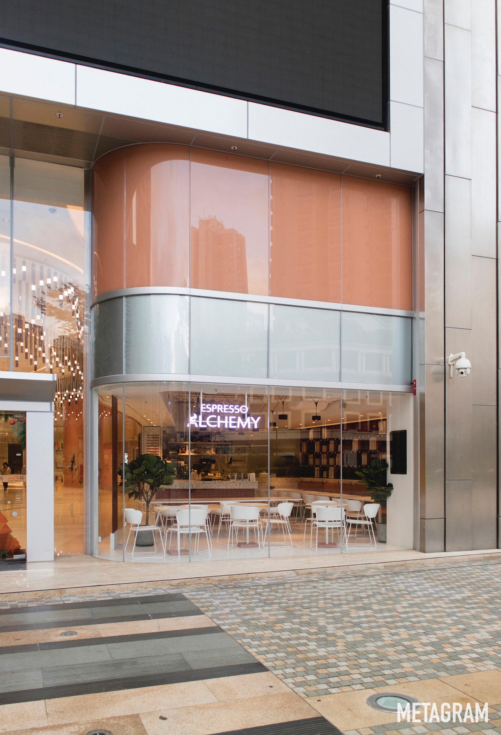 Espresso Alchemy’s curved glass storefront at Nina Mall 1 in Tsuen Wan.