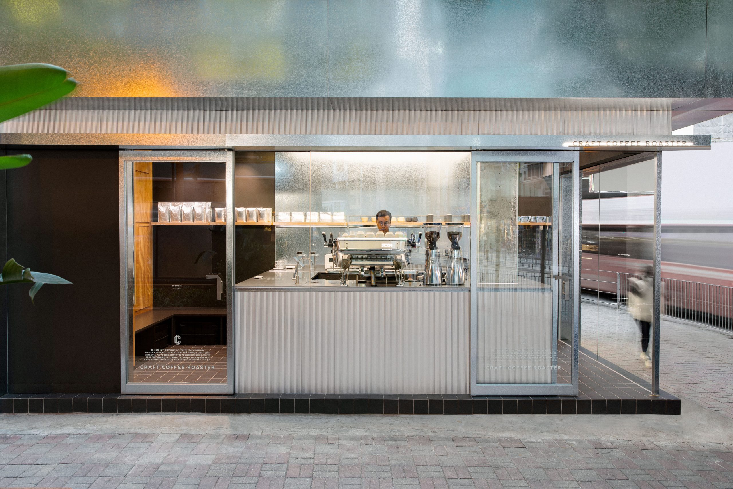 Craft Coffee Roaster’s glazed storefront and central espresso counter on Morrison Hill Road.